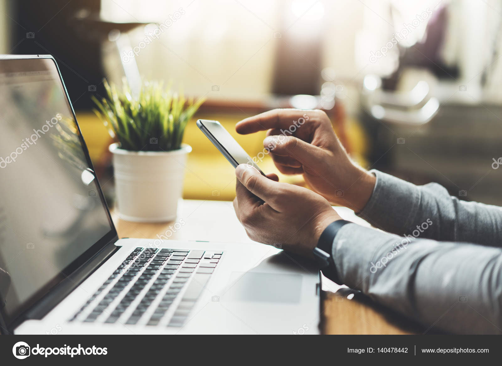 depositphotos-140478442-stock-photo-businessman-using-smartphone